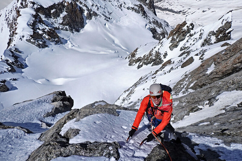 Emanuele Andreozzi reaching the third belay on the north face of Dent du Géant.