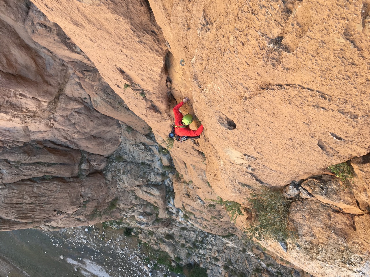 climber on brown wall