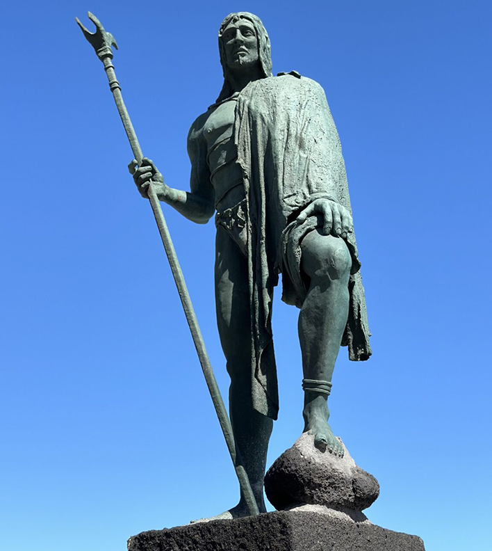 statue of ancient guy with trident