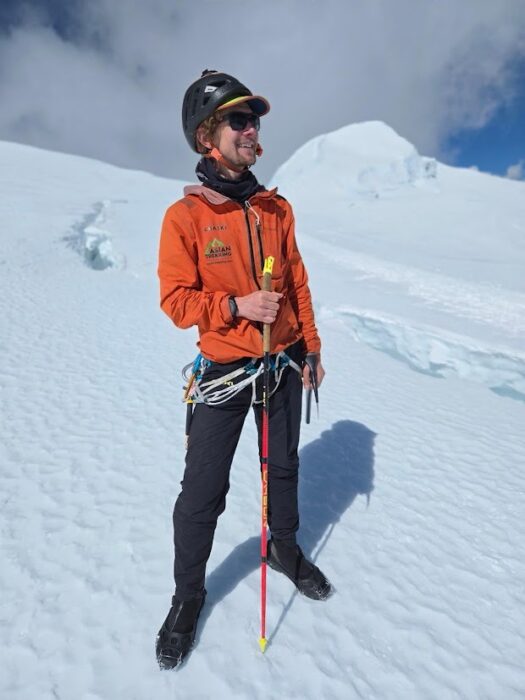 Tyler Andrews on a snow slope witha helmet, light jacket and very light boots.