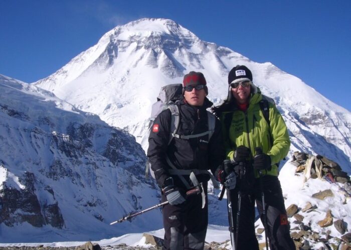 Goettler and Kaltenbrunner pose in front of Dhaulagiri in a sunny day. 