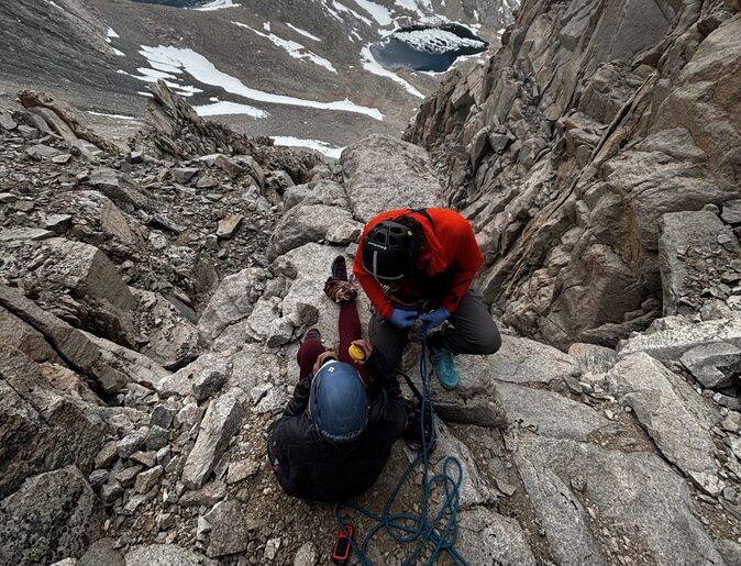 Two people on a rocky ledge