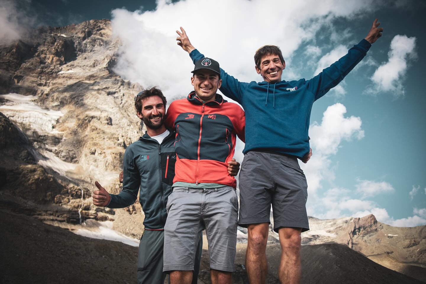 Yooung climbers smile with Matterhorn in background.
