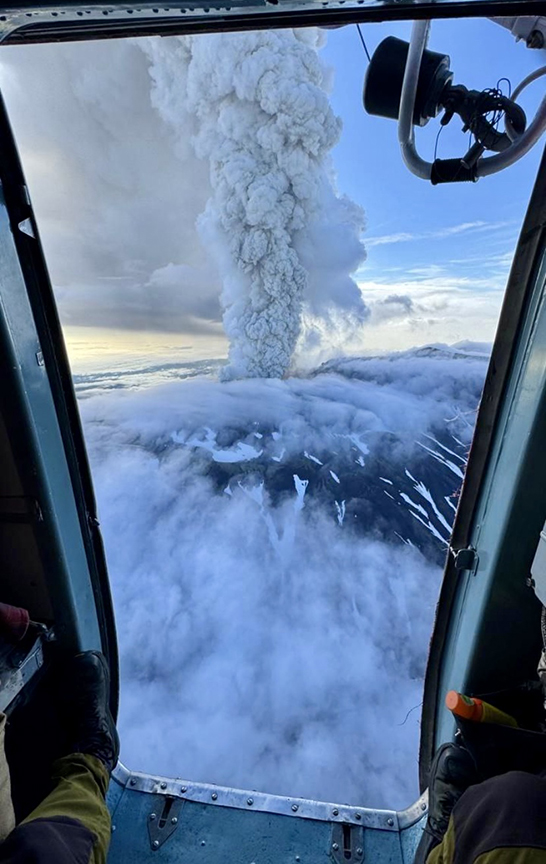 ash plume from volcano seen from the air