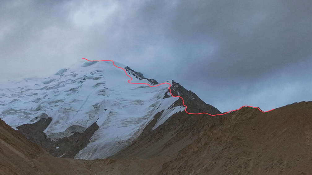 The new route on the summit ridge to the top marked in red
