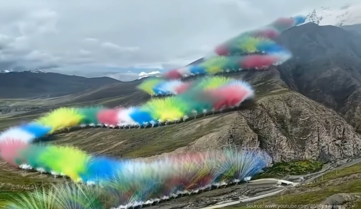 'snake' of fireworks going up a mountain