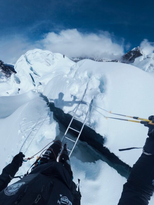 A crevasse as seen by the climber, ready to cross thanks to an aluminium ladder. 