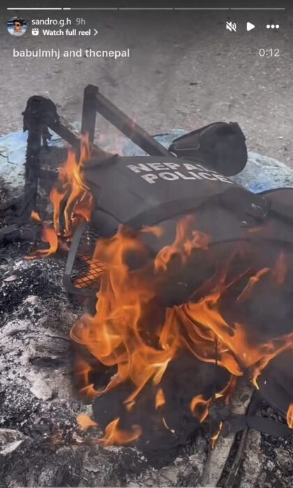 IG story showing a photo riot police vest burning. 
