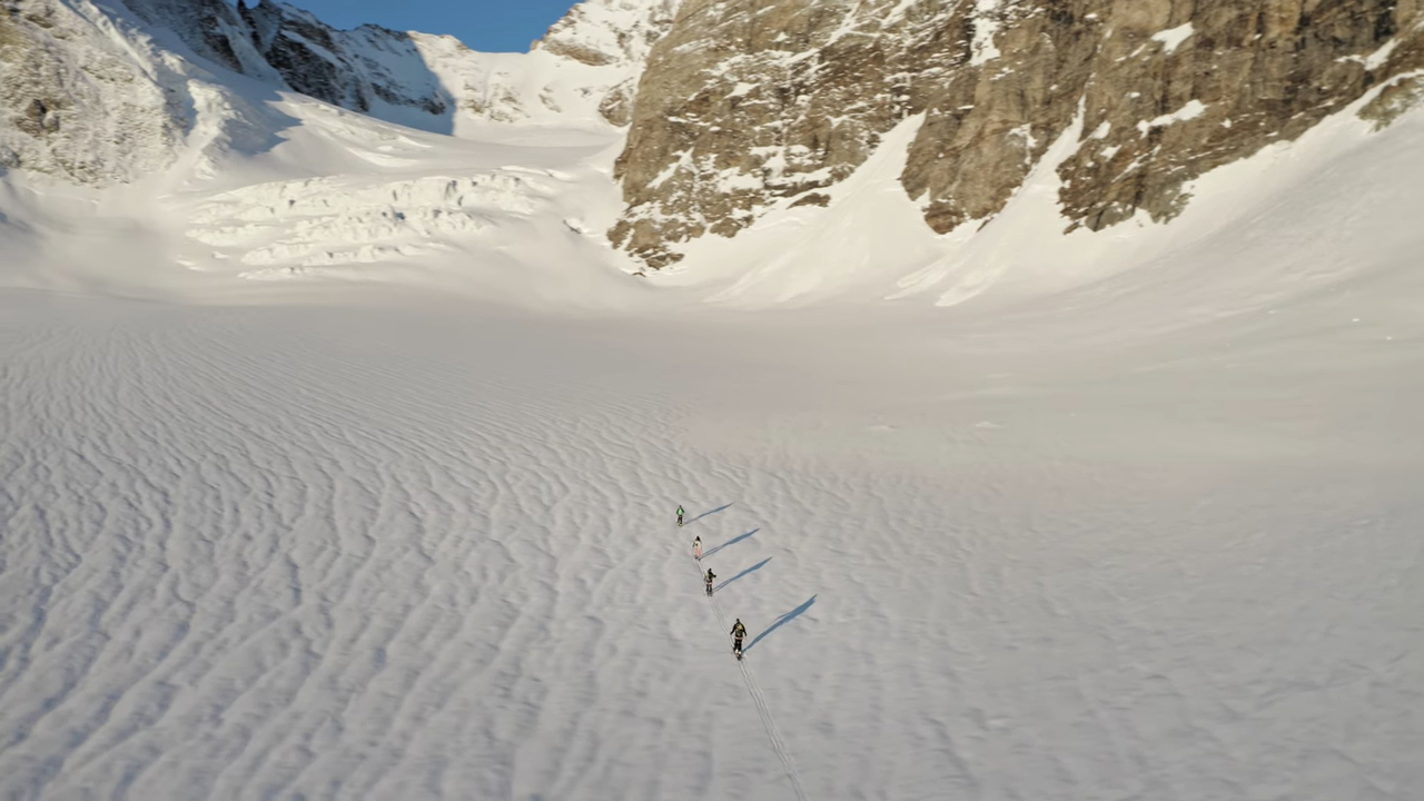 Four people skiing