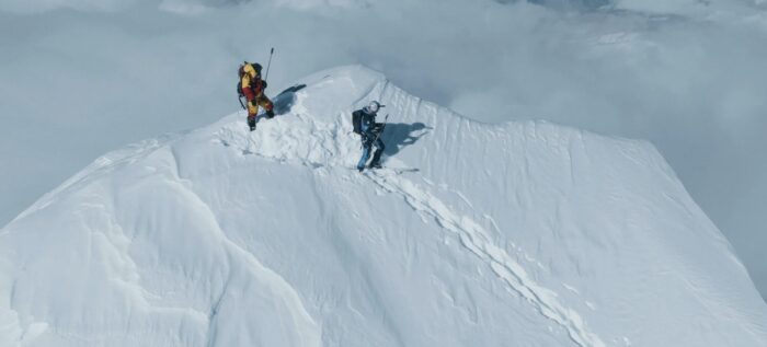 Bargiel about to start descending with skis on, from the snowyy summit of Everest.