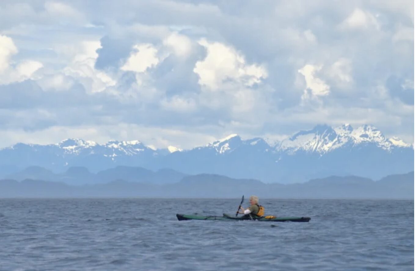 kayaker and mountains