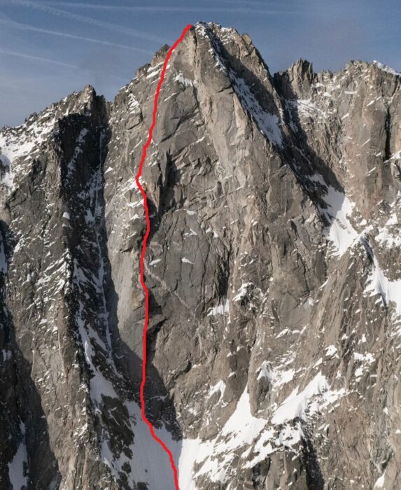 A route marked in red on a photo of Wildgall peak. 