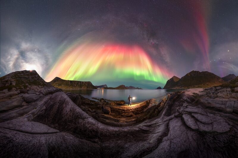 A double arc of the Milky way and Aurora Borealis over the Arctic