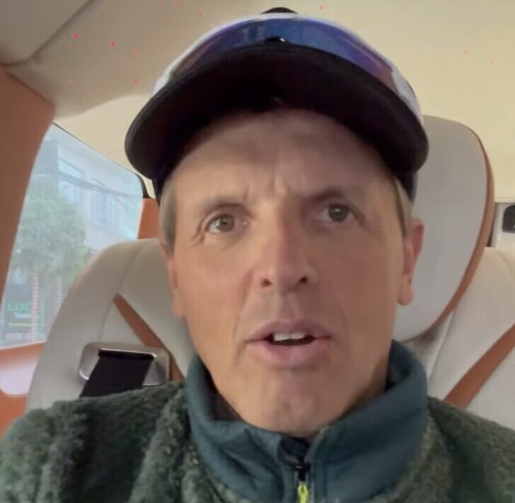 Close shot of Simone Moro speaking in a car.