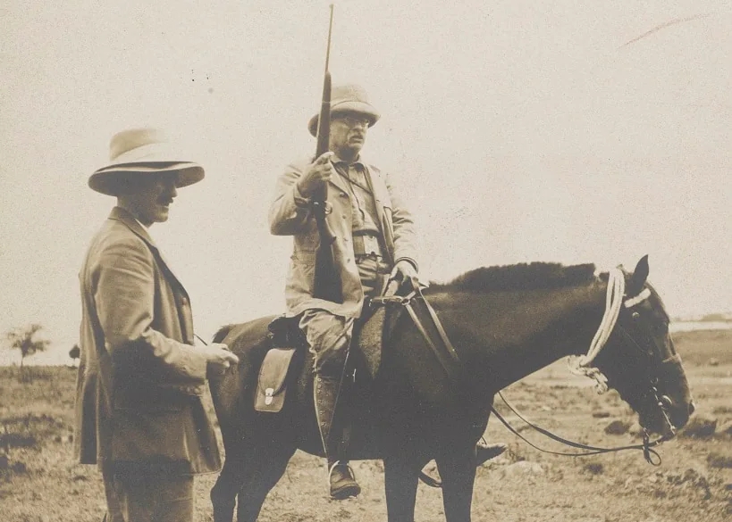 A man on horseback with a gun