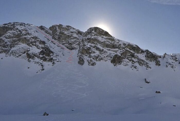 A mountain with an ascent route marked in red.