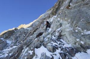 climber on rocky/snowy wall
