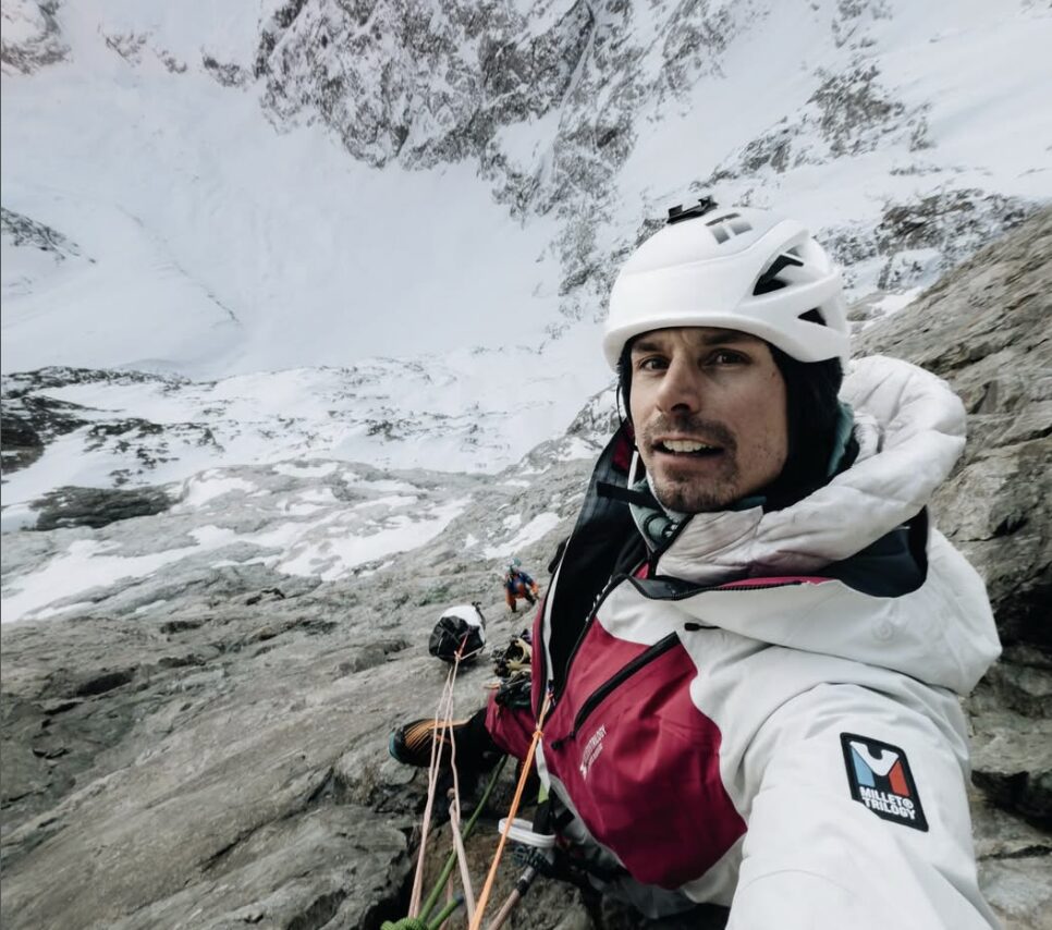 Selfie by Dubouloz at a belay on a huge rock and ice face.