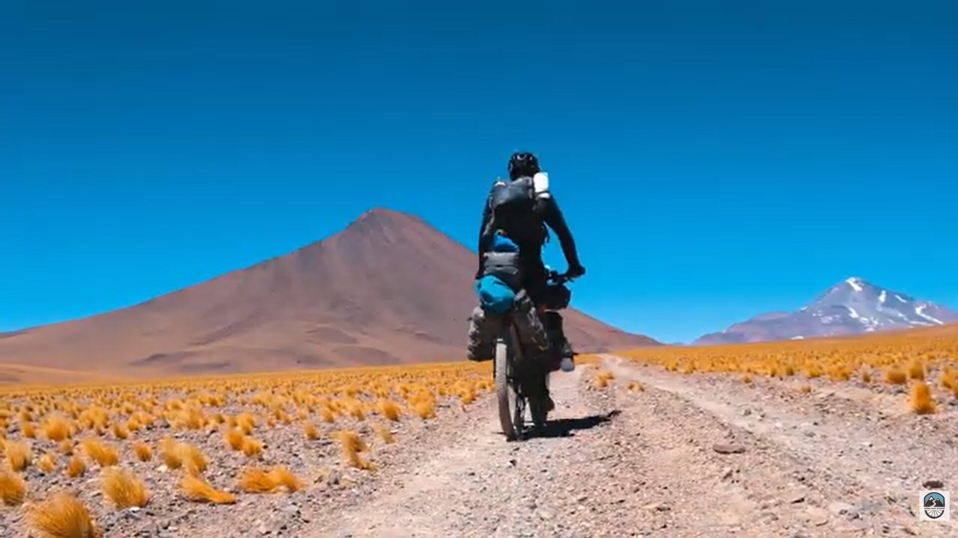 A bike amid mountain grasses.