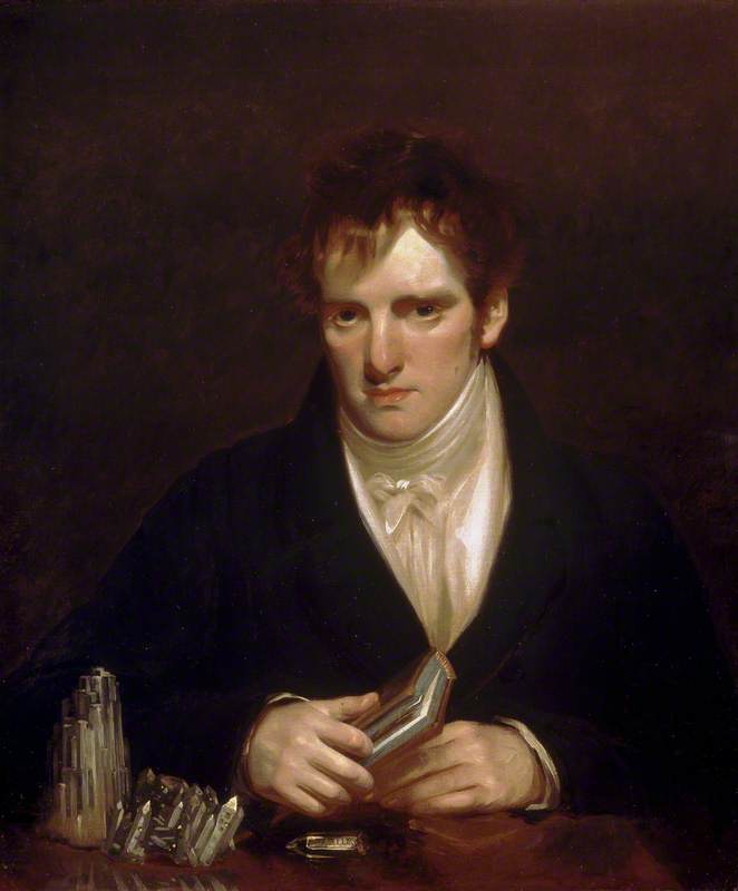 portrait of a young man with rocks