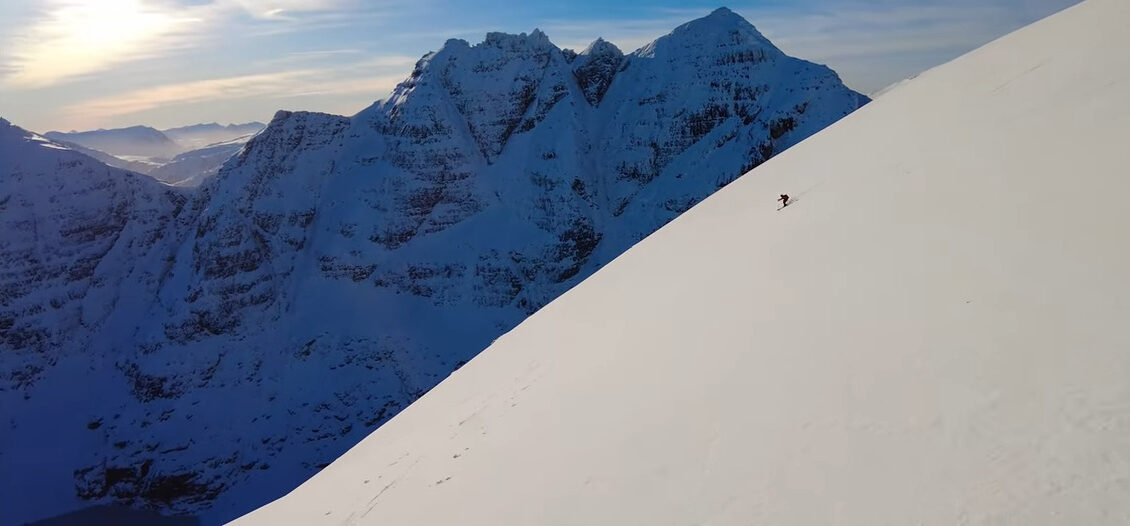 lone skier on gentle snowy mountain