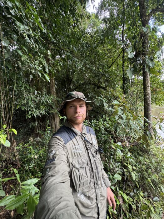 Swiss Adventurer Loic Cappellin standing in the rainforest of French Guiana