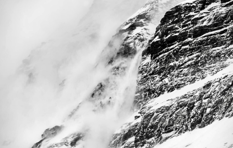 Small snow slides on the lower sections of Dhaulagiri I, near Base Camp in 2021.