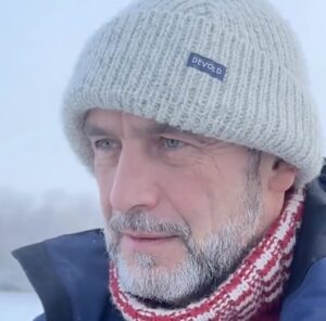 bearded man in hat