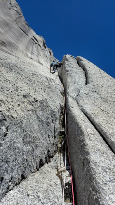 A climber on a crack system in Cochamo valley, Chile.