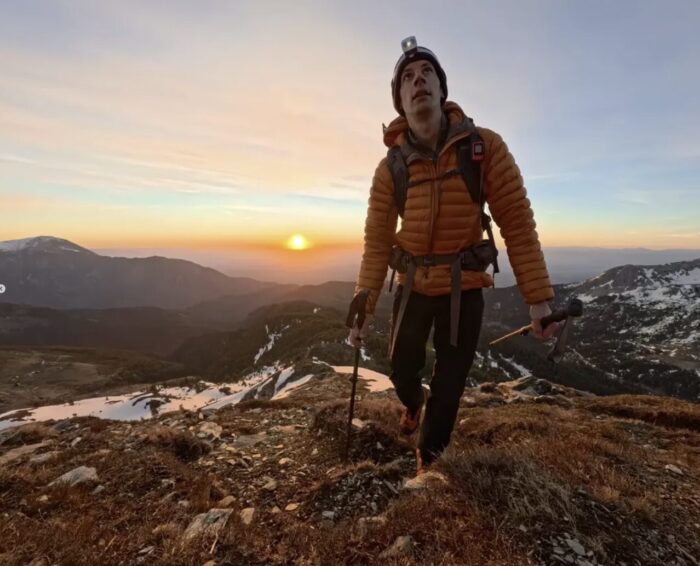 Madalin Cristea hiking at sunset.