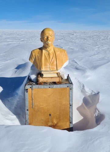 A bust of Lenin at the Antarctic Pole of Inaccessibilty surrounded by snow.