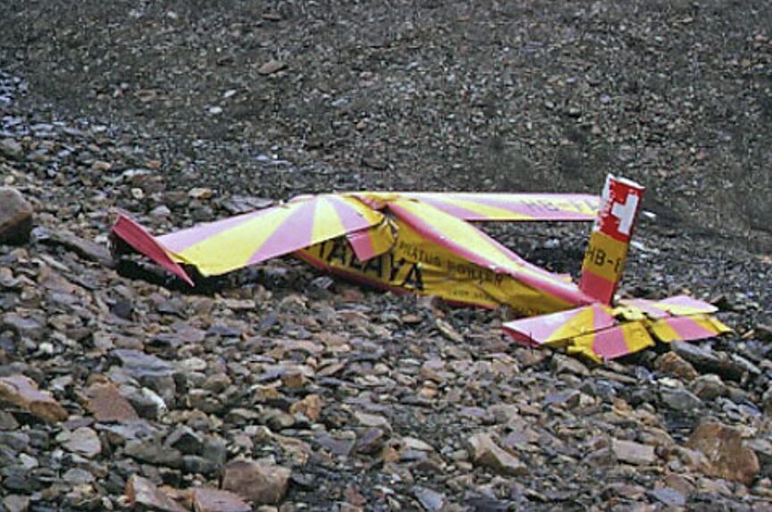 broken aircraft on rocks