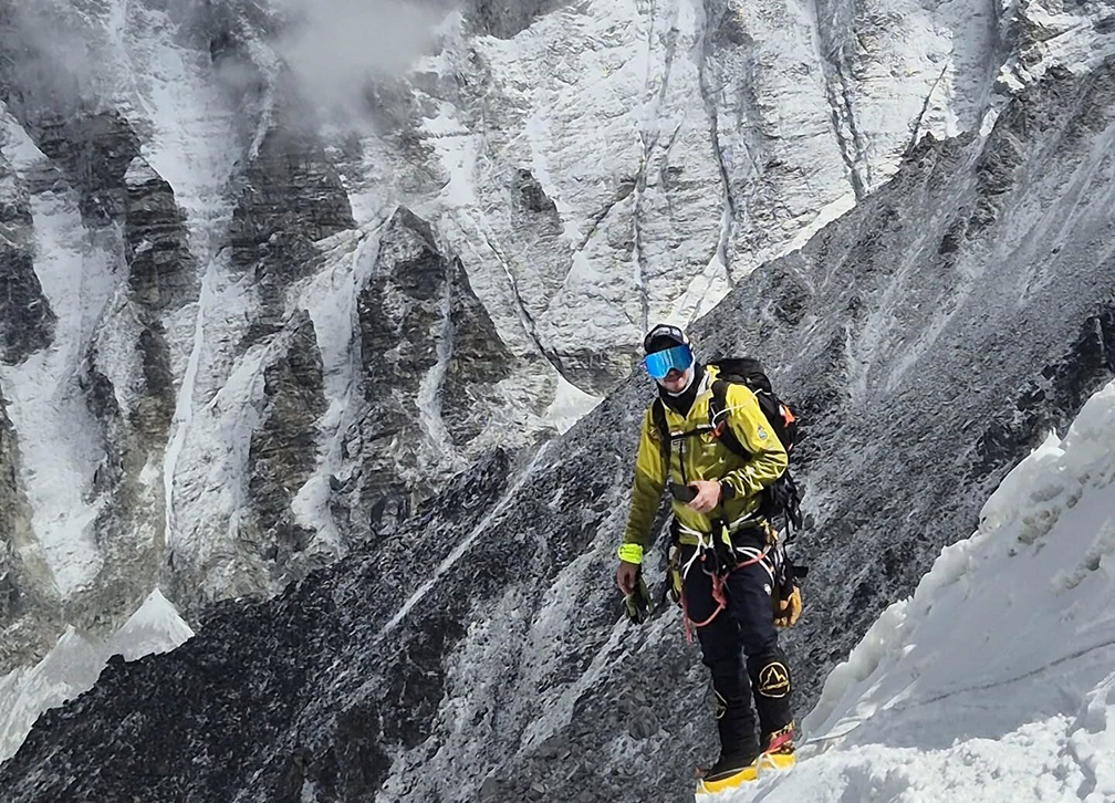 A climber with no O2 system on a steep slope on Everest.