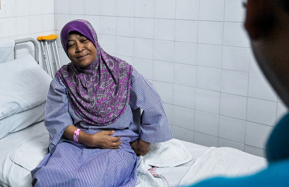 muslim woman sitting up in bed