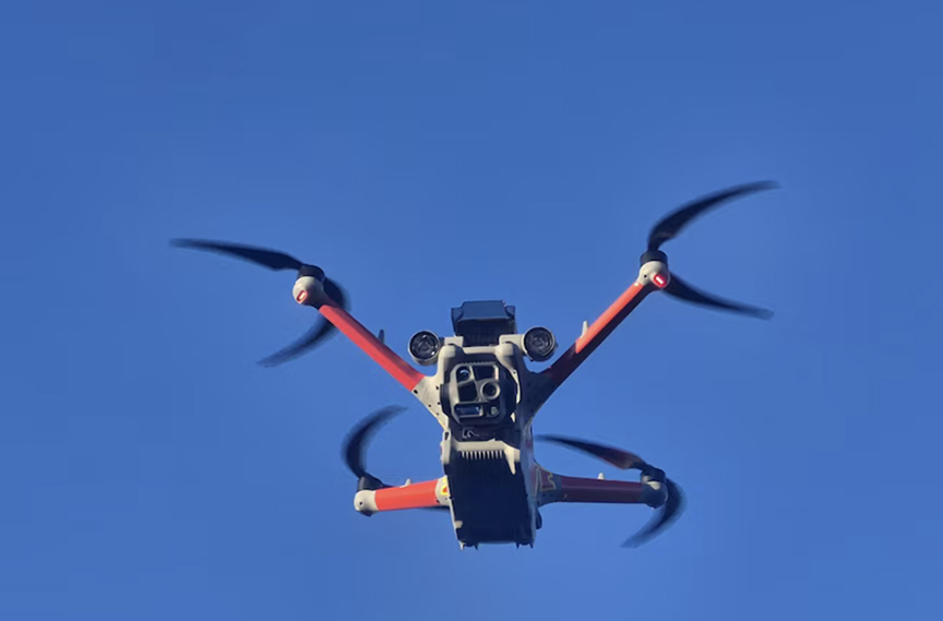 drone in air against blue sky