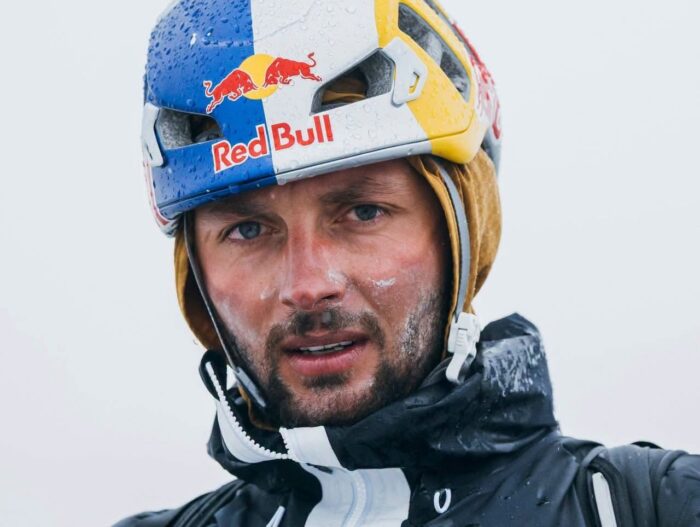 Close shot of Andrzej Bargiel. with Red Bull helmet.