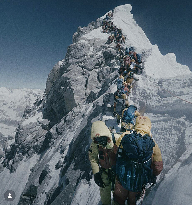Climbers crowding the ridge to the summit of Everest.