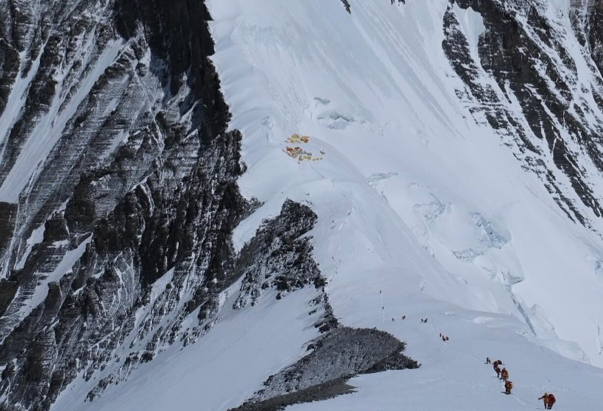 a camp on the NE ridge of Everest, looking very small compared to the mighty north face.