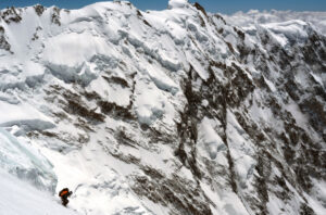 Tiphaine Duperier desdending from Camp 4 to Camp 3 on the Kinshofer Route of Nanga Parbat, with the Mazeno Ridge behind.