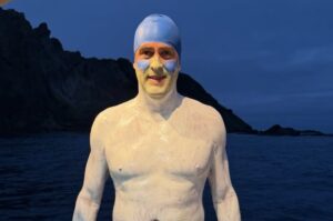 swimmers at twilight