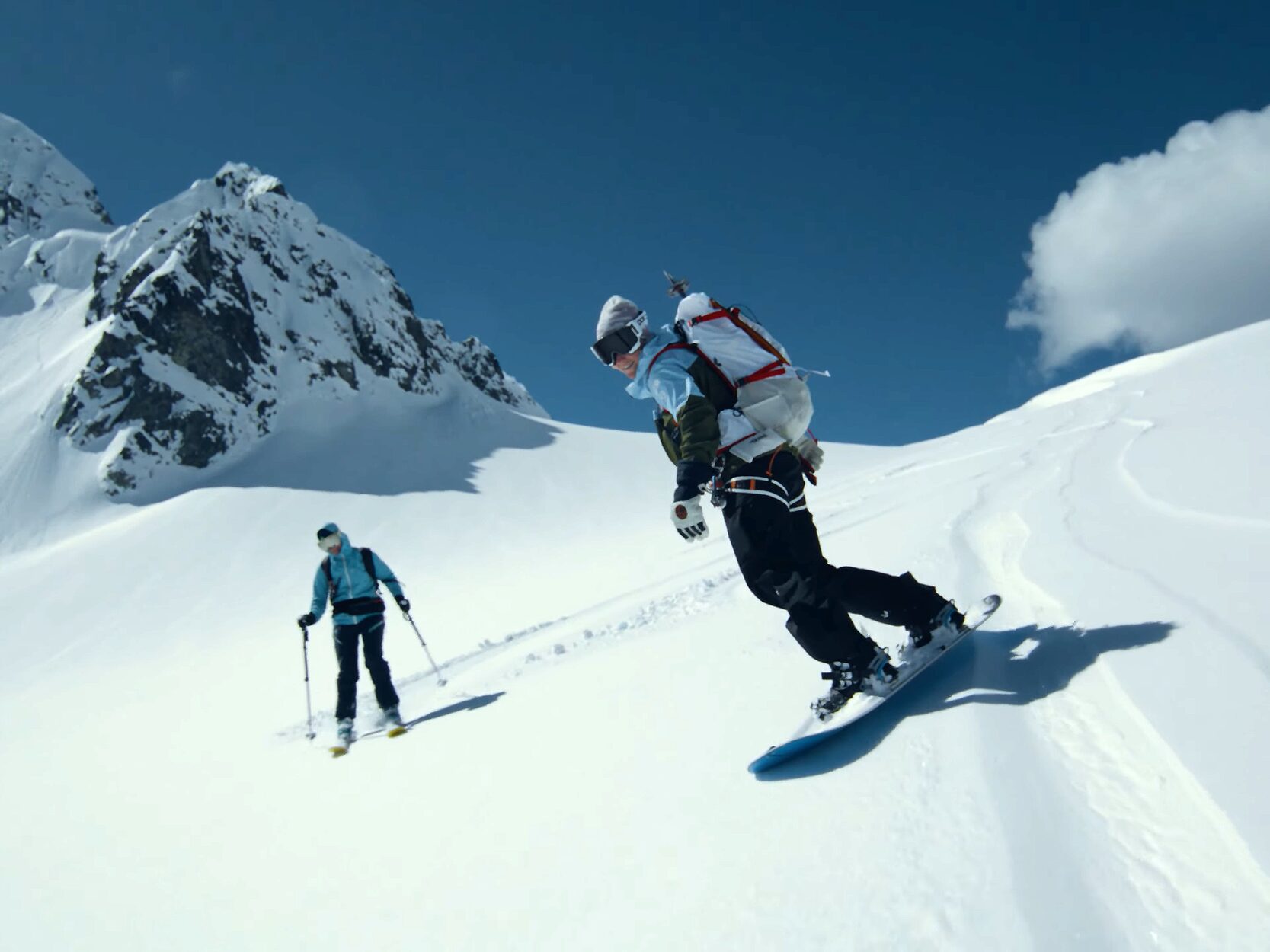 Two people snowboarding