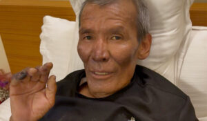 Close shot of injured Dawa Sherpa in bed.