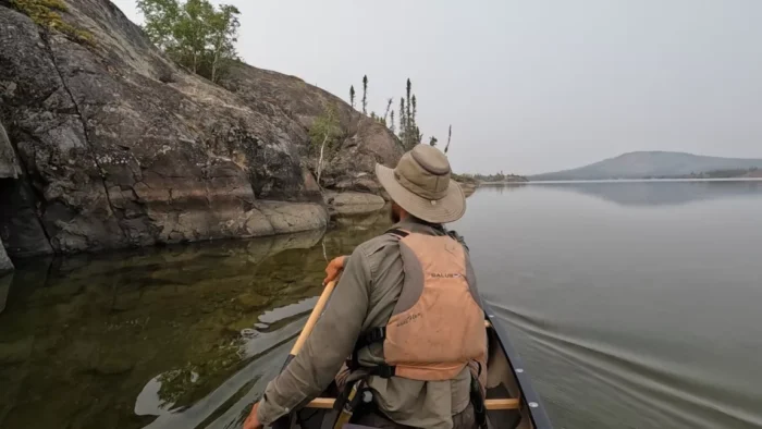 Man canoeing in the north of Canada