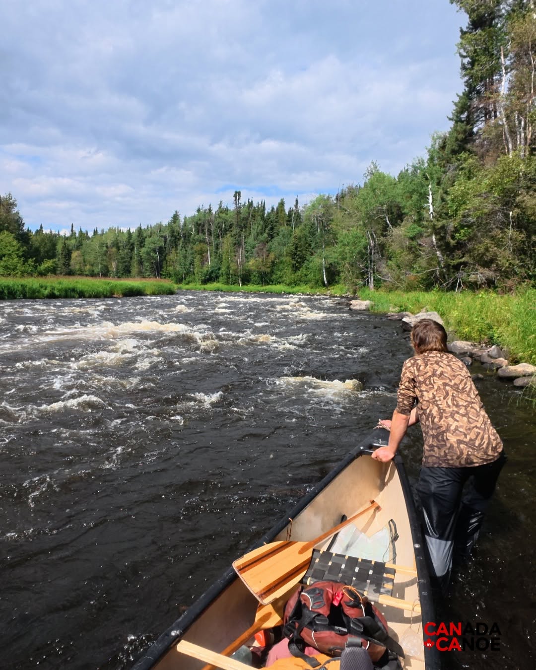 Dragging the canoe up rapids during segment 11.