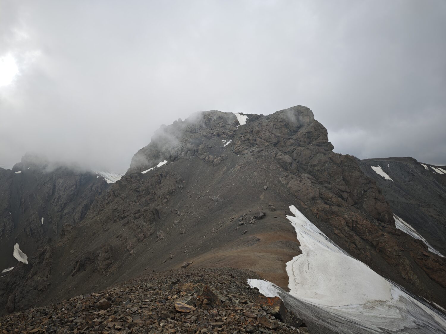 The upper sections of Muz Tau in worsening weather.