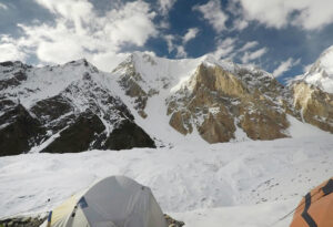 A tent in front of mountains