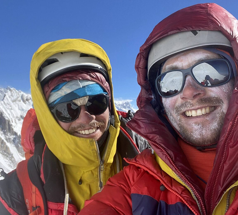 selfie of two smiling climbers